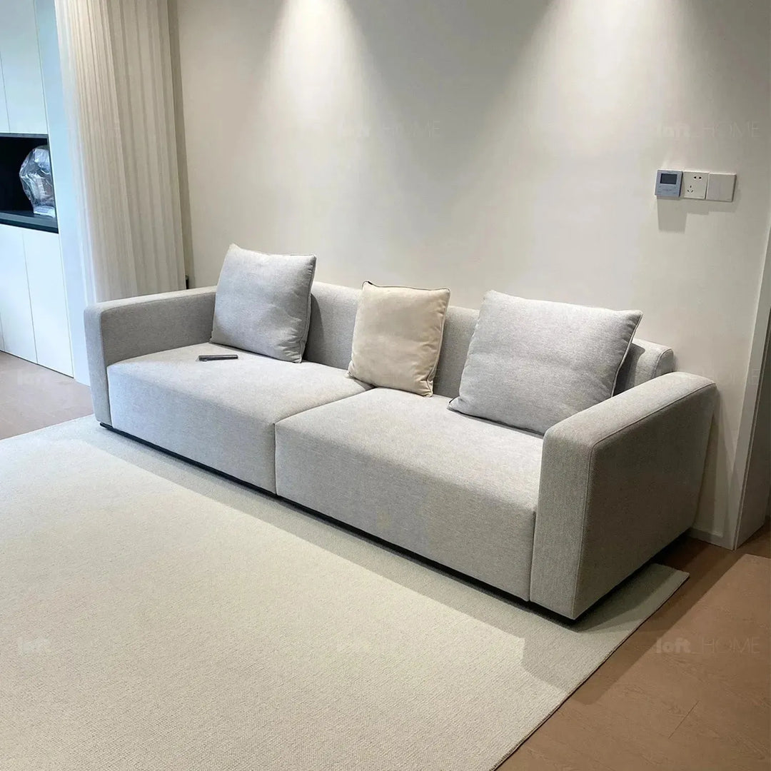 Minimalist fabric 4 seater sofa nemo with context.