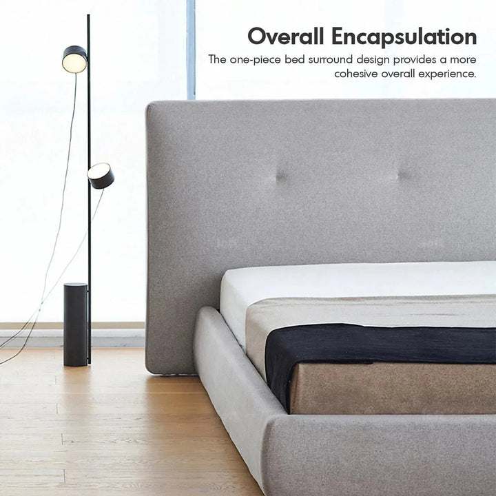 Minimalist fabric bed charles with context.