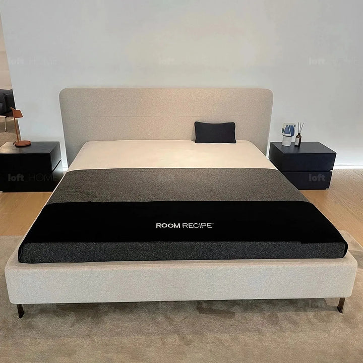 Minimalist fabric bed hel in panoramic view.