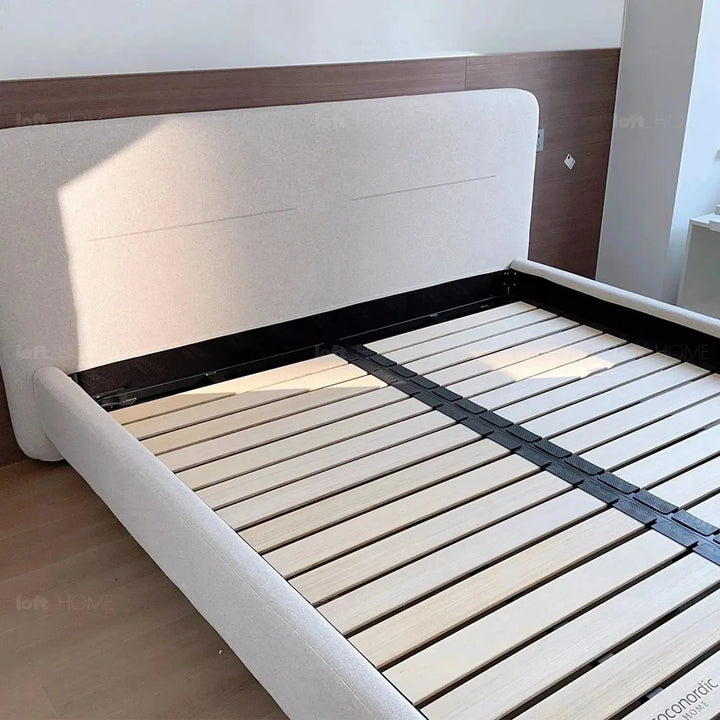 Minimalist fabric bed hel layered structure.
