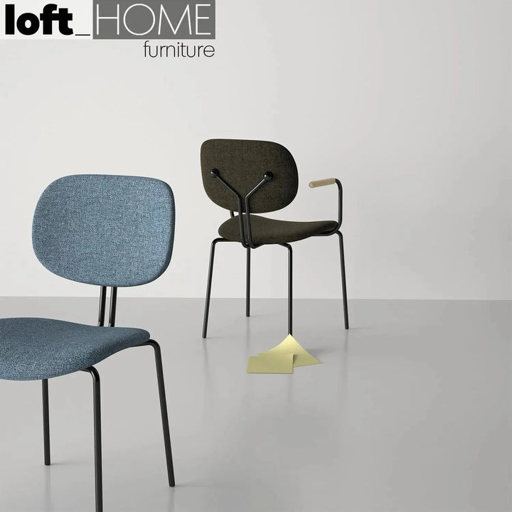 Industrial fabric dining chair et arm in still life.