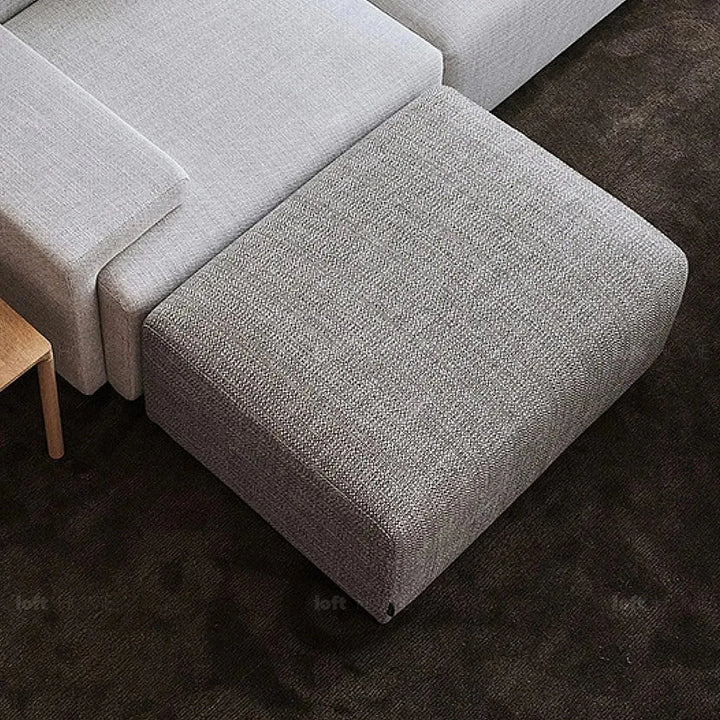 Minimalist fabric ottoman nemo in details.