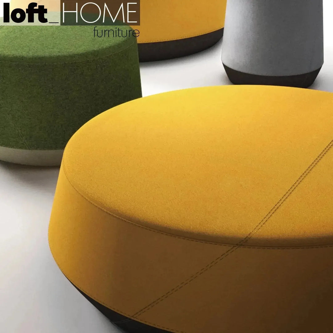 Modern fabric ottoman buono with context.