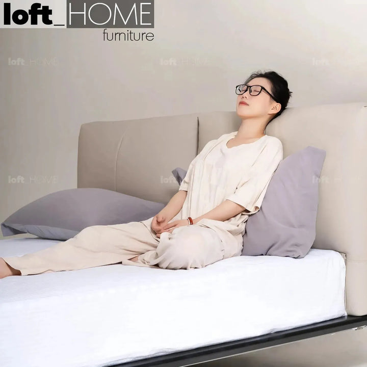 Minimalist genuine leather floating bed fides with context.