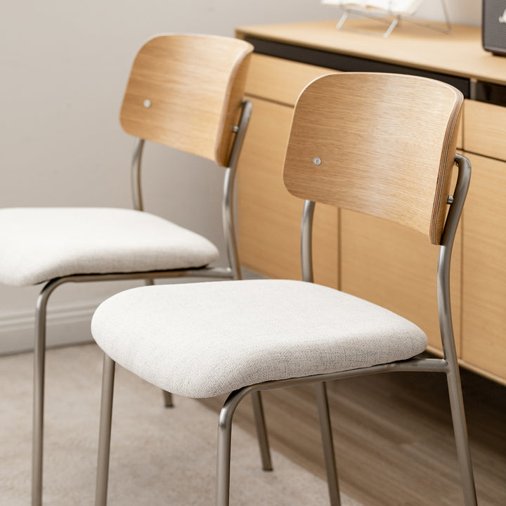 Minimalist ash wood veneer cotton fabric dining chair aeri in still life.