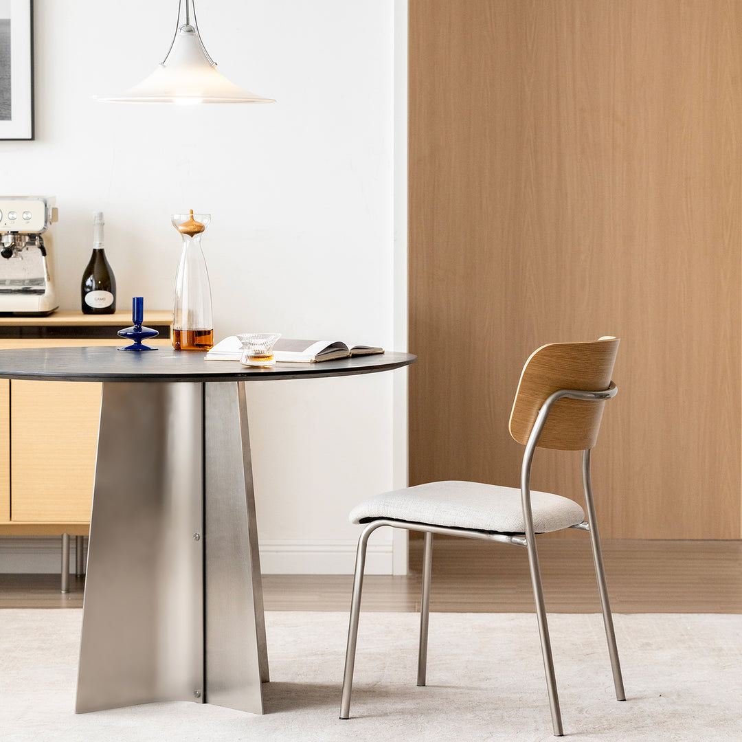 Minimalist ash wood veneer cotton fabric dining chair aeri in close up details.