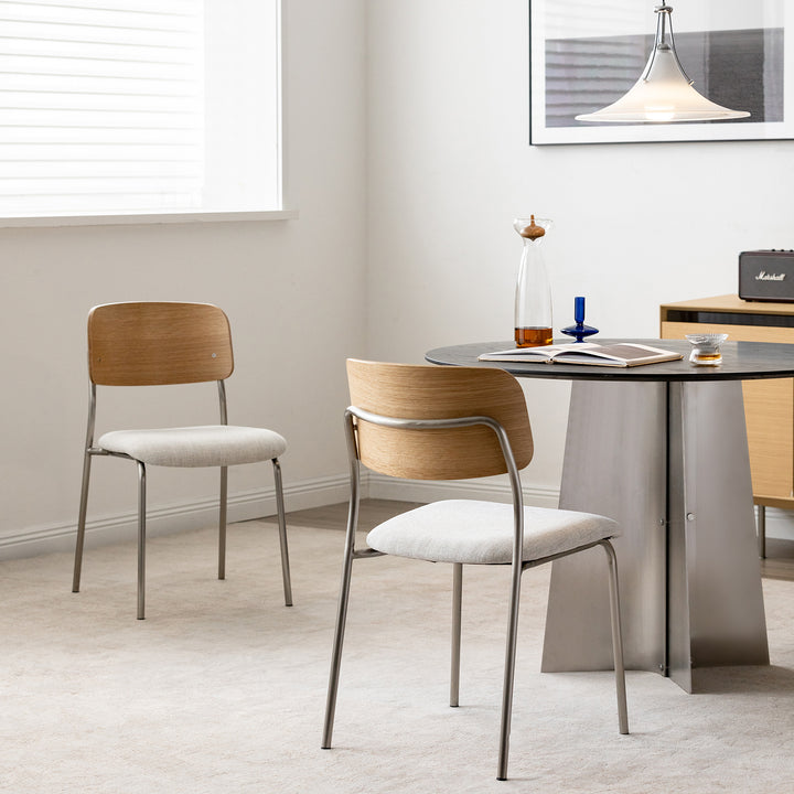 Minimalist ash wood veneer cotton fabric dining chair aeri in panoramic view.