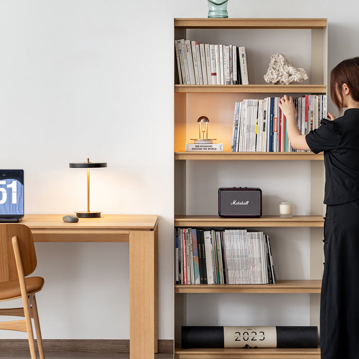 Minimalist stainless steel bookshelf aesop with context.