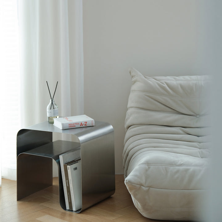 Minimalist steel side table arc in real life style.