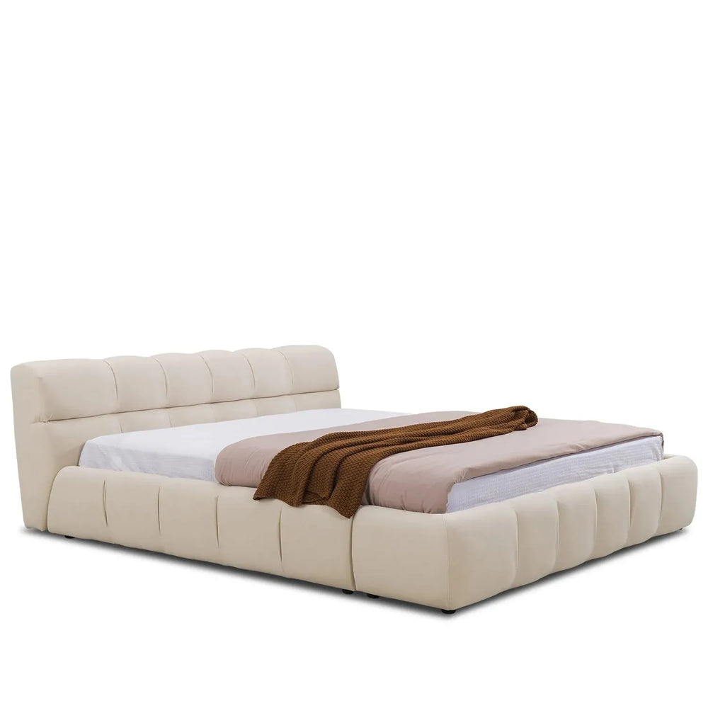 Contemporary suede fabric bed tufty in white background.