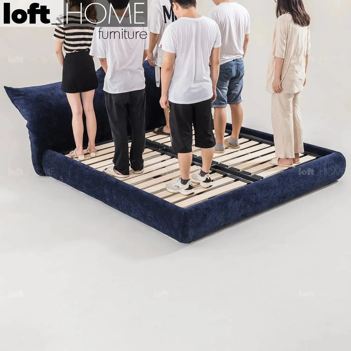 Contemporary velvet fabric bed standard in still life.