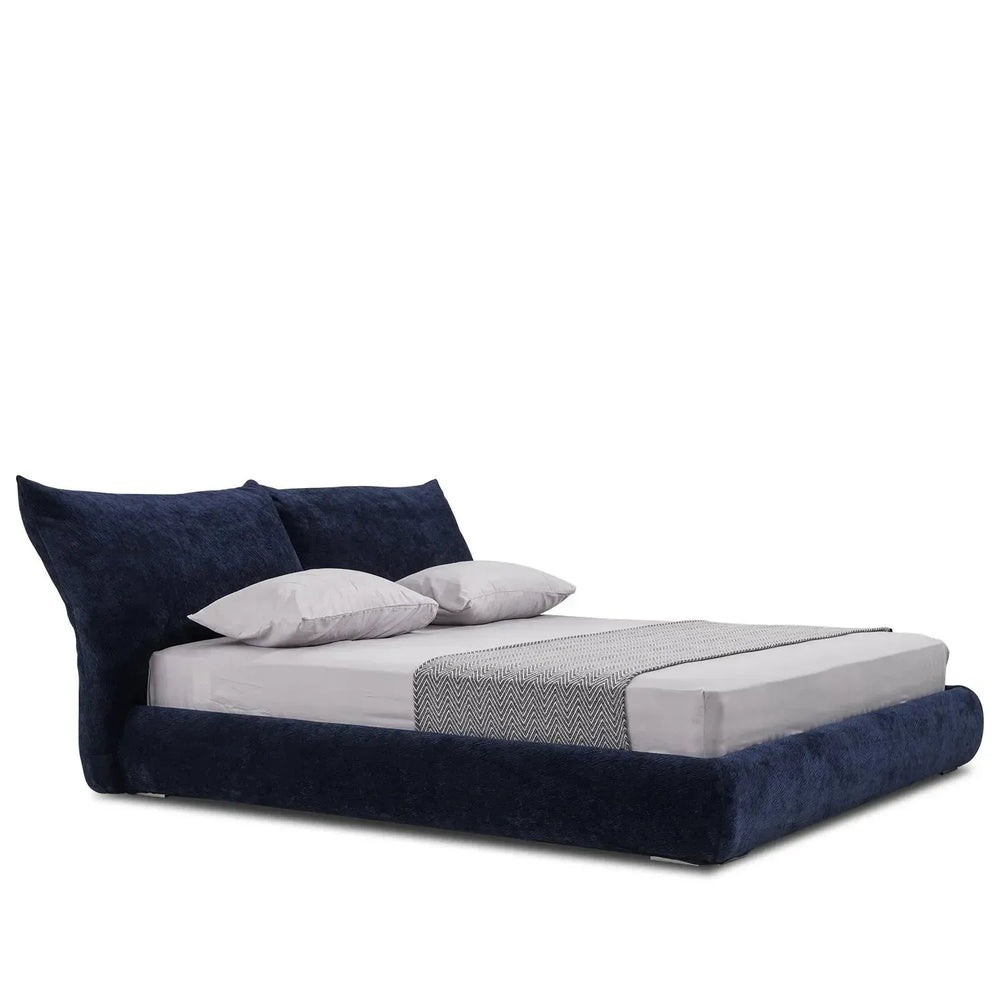Contemporary velvet fabric bed standard in white background.
