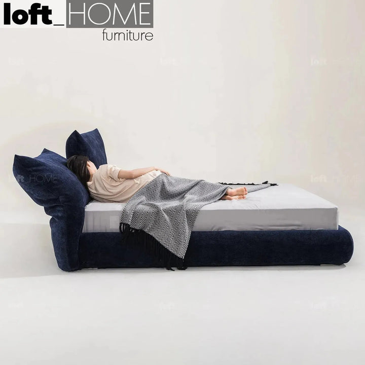 Contemporary velvet fabric bed standard with context.