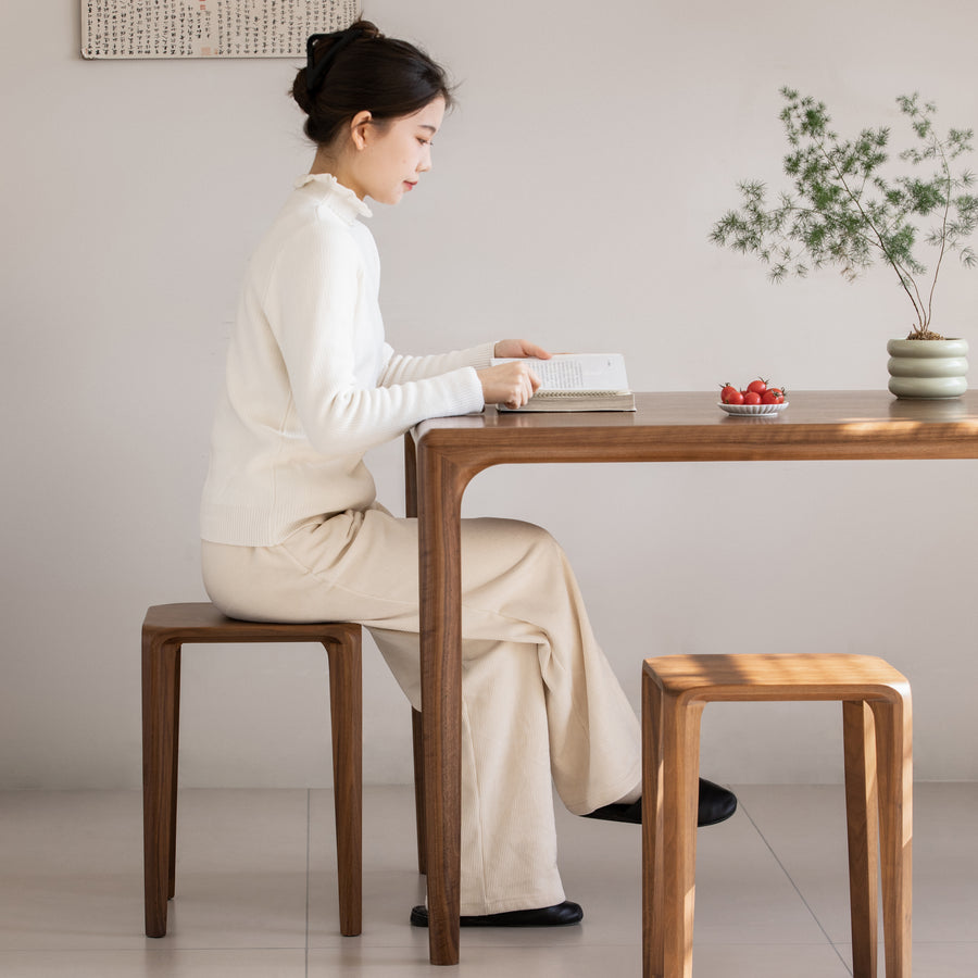 Minimalist walnut wood stool conti primary product view.