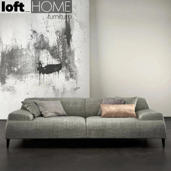 Modern fabric 3 seater sofa cave with context.