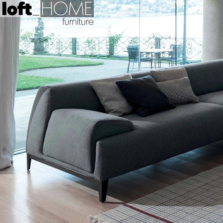 Modern fabric 3 seater sofa cave in still life.