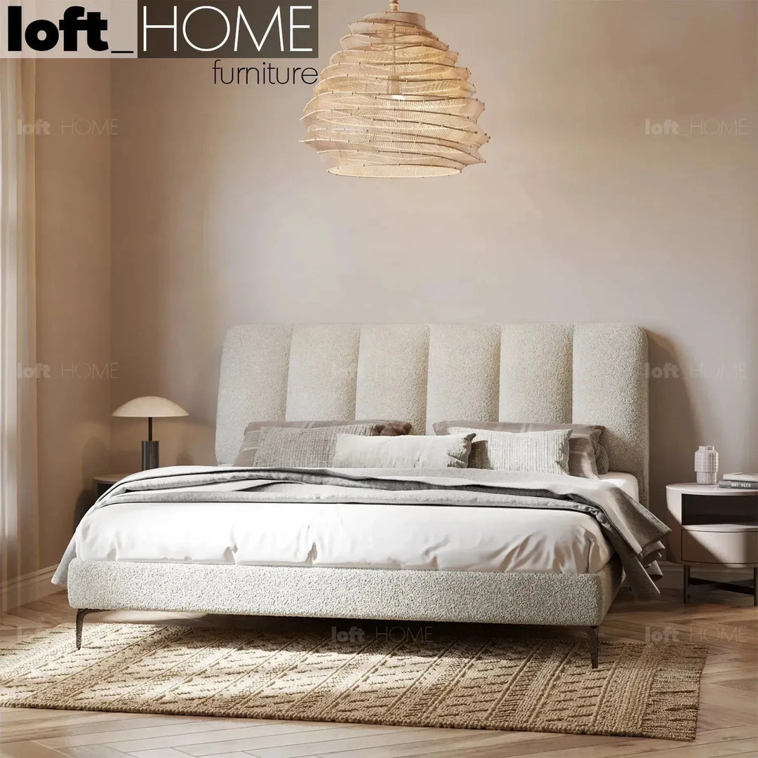 Cream sheepskin fabric bed cory in close up details.