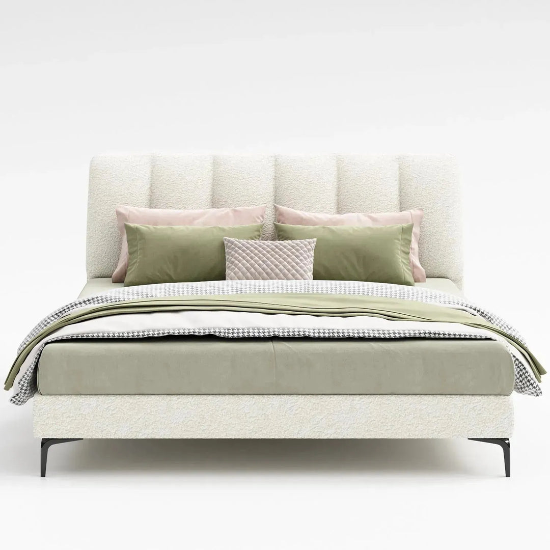 Cream sheepskin fabric bed cory with context.