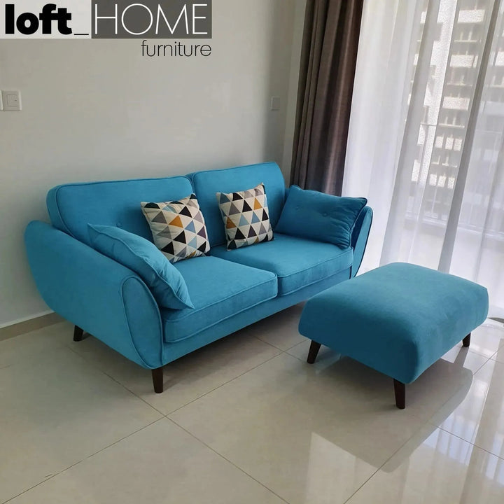 Scandinavian fabric ottoman henri in close up details.