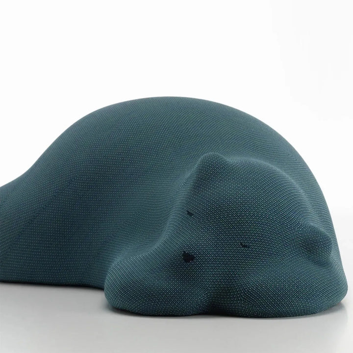 Contemporary knit fabric ottoman resting bear environmental situation.