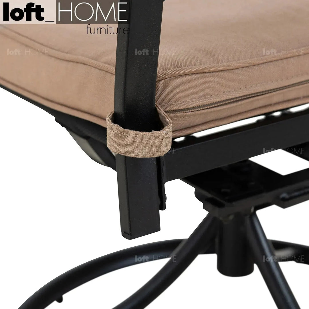 Industrial outdoor revolving dining chair patio in close up details.