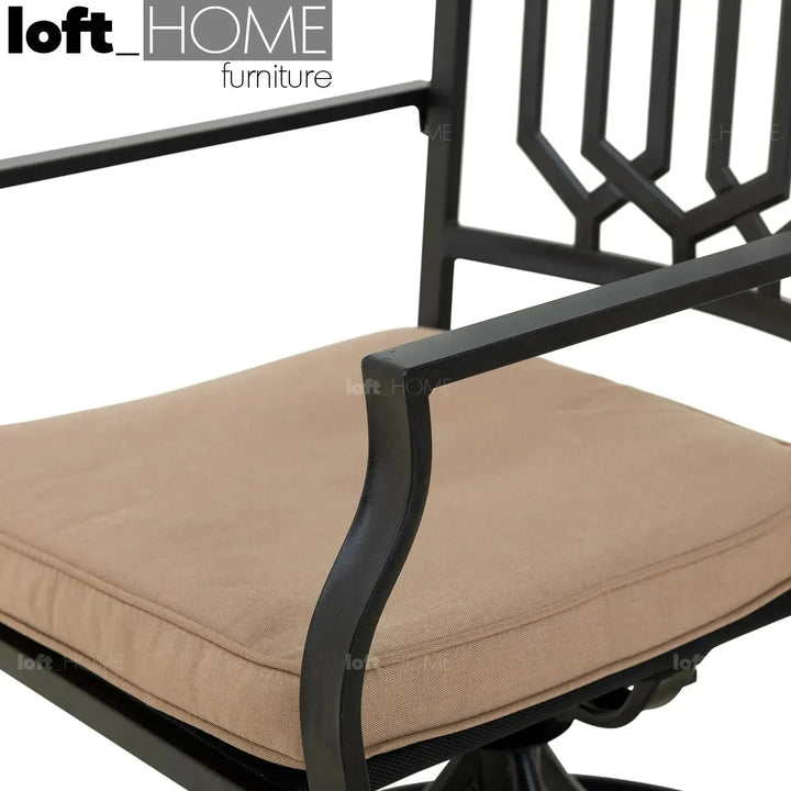 Industrial outdoor revolving dining chair patio with context.