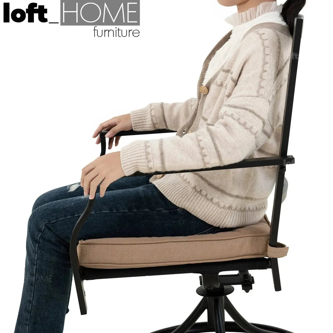 Industrial outdoor revolving dining chair patio in real life style.