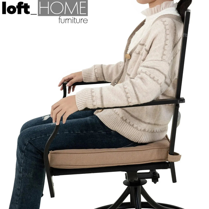 Industrial outdoor revolving dining chair patio in real life style.