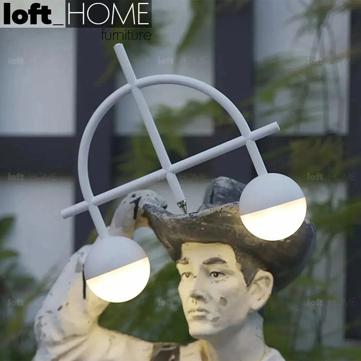 Contemporary steel charging table lamp balance in details.