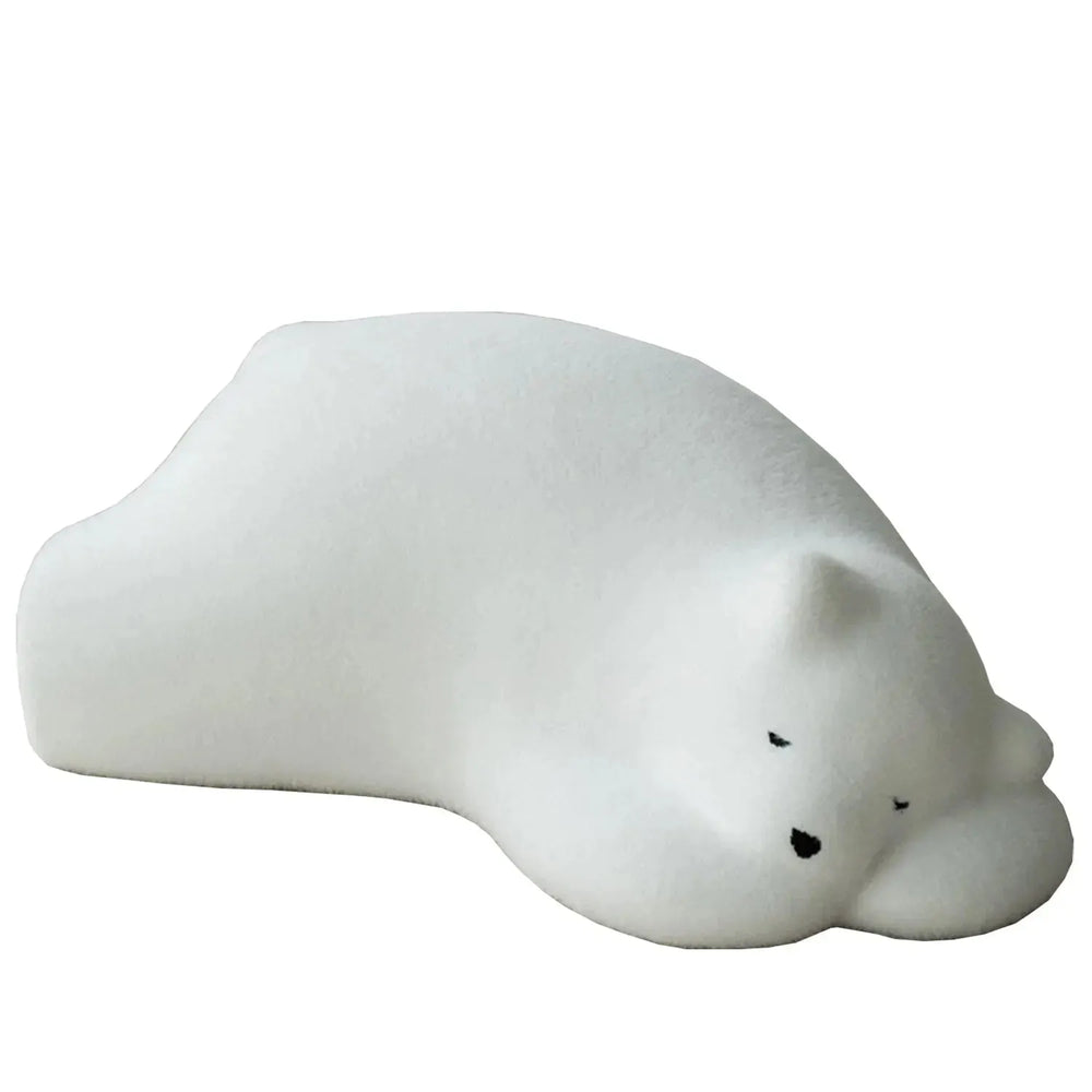 Contemporary velvet ottoman resting bear white in white background.