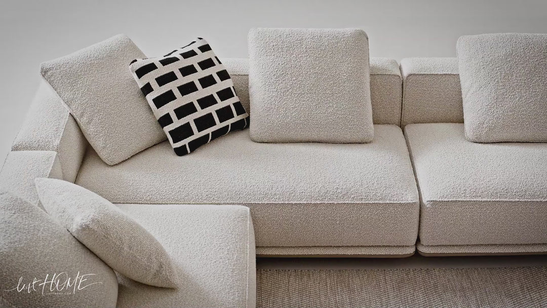 Minimalist mixed weave fabric modular l shape sectional sofa eleganza 1+l in still life.