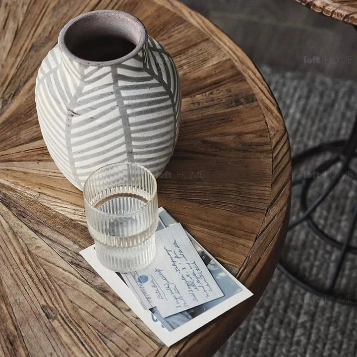 Rustic elm wood foldable round coffee table eclipse elm in still life.