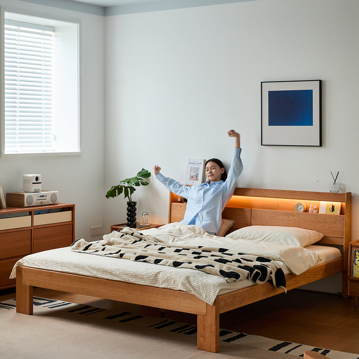 Scandinavian cherry wood bed accompany light with context.