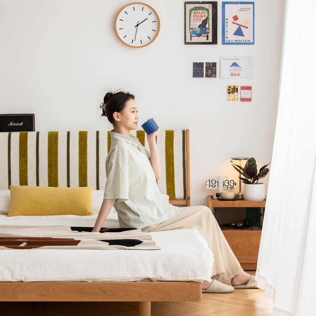 Scandinavian cherry wood bed les in close up details.