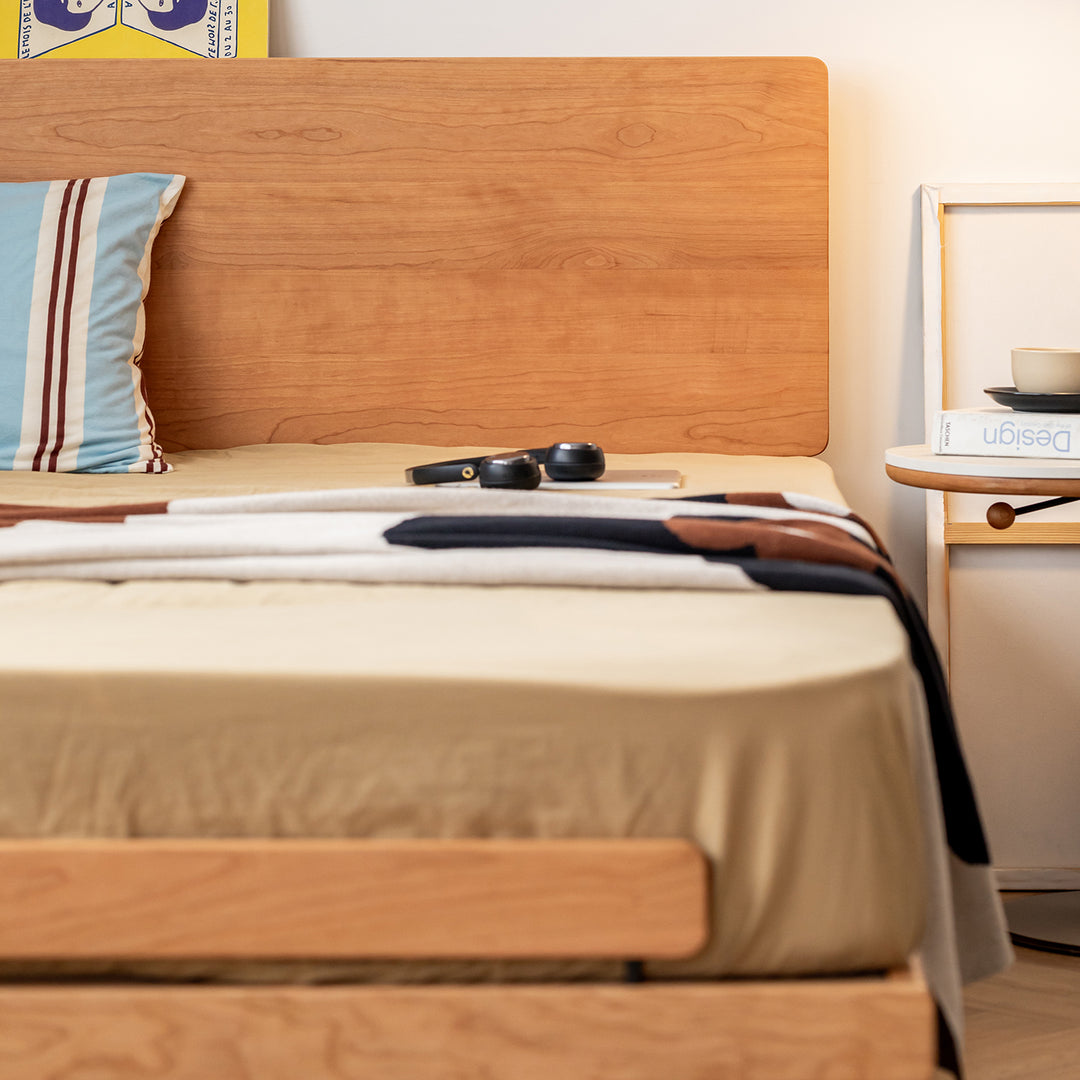 Scandinavian cherry wood bed small in panoramic view.