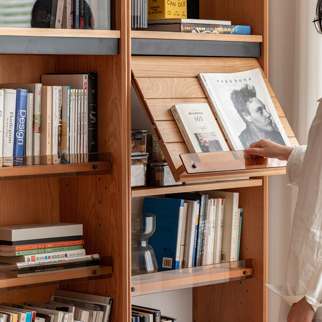 Scandinavian cherry wood bookshelf story in still life.