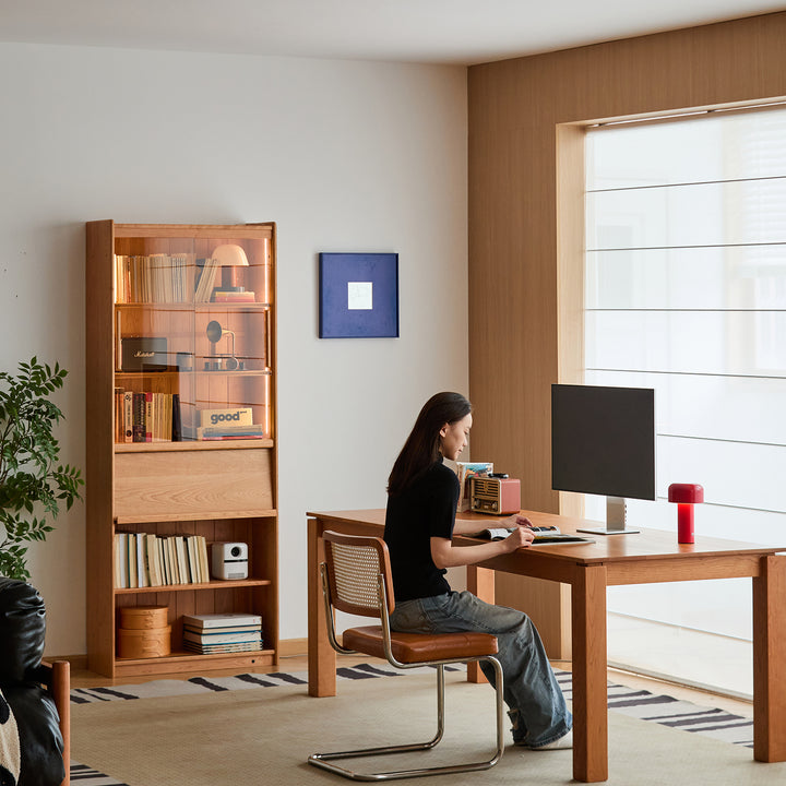 Scandinavian cherry wood bookshelf vista in panoramic view.