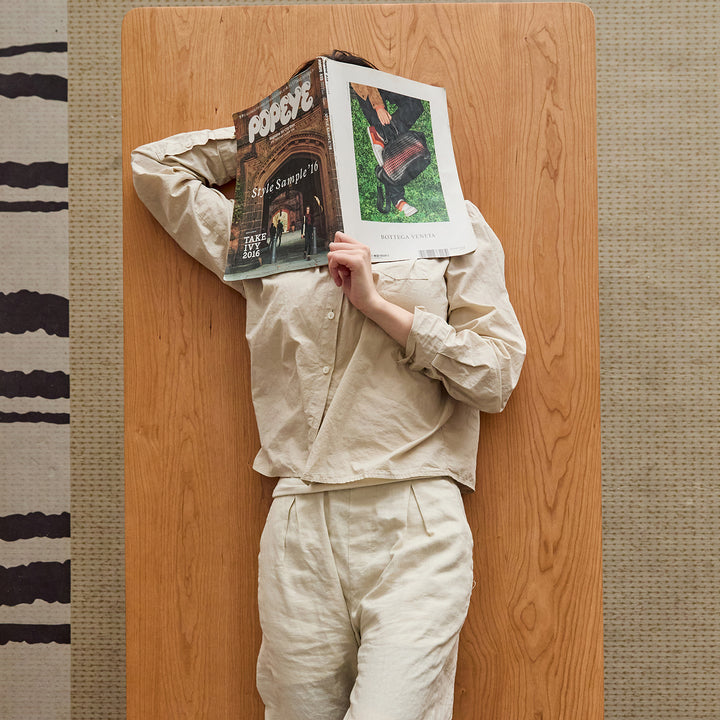 Scandinavian cherry wood dining table square in panoramic view.