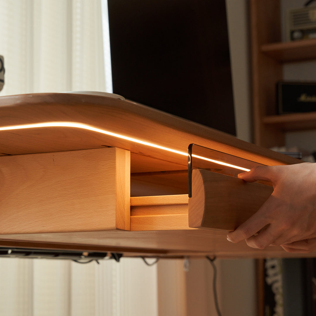 Scandinavian cherry wood electric height adjustable study table up in panoramic view.