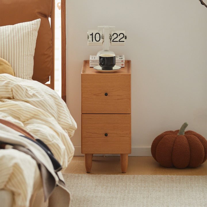 Scandinavian cherry wood side table cabo with context.