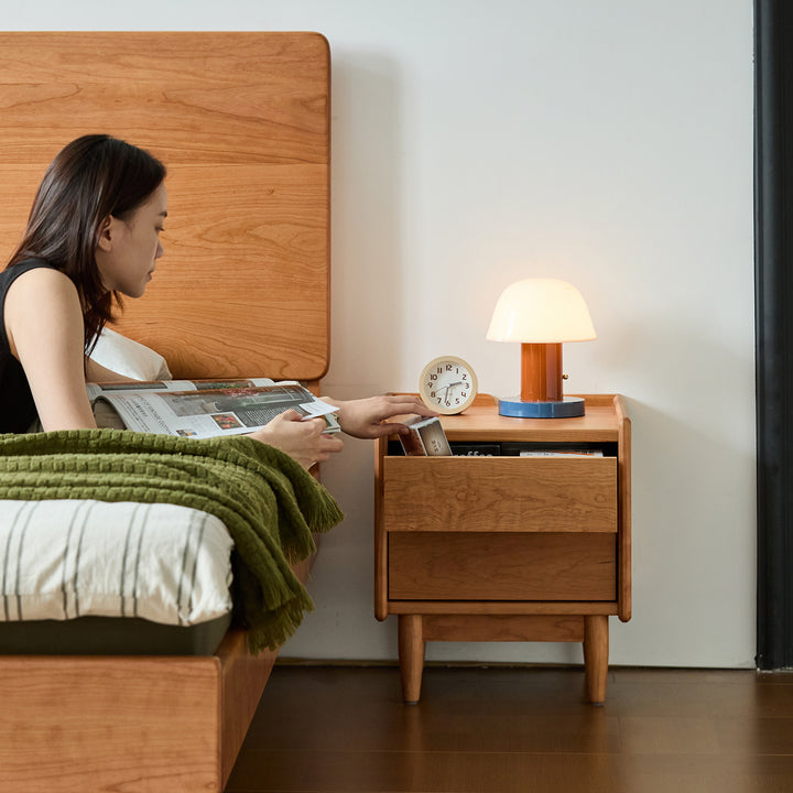 Scandinavian cherry wood side table vista environmental situation.