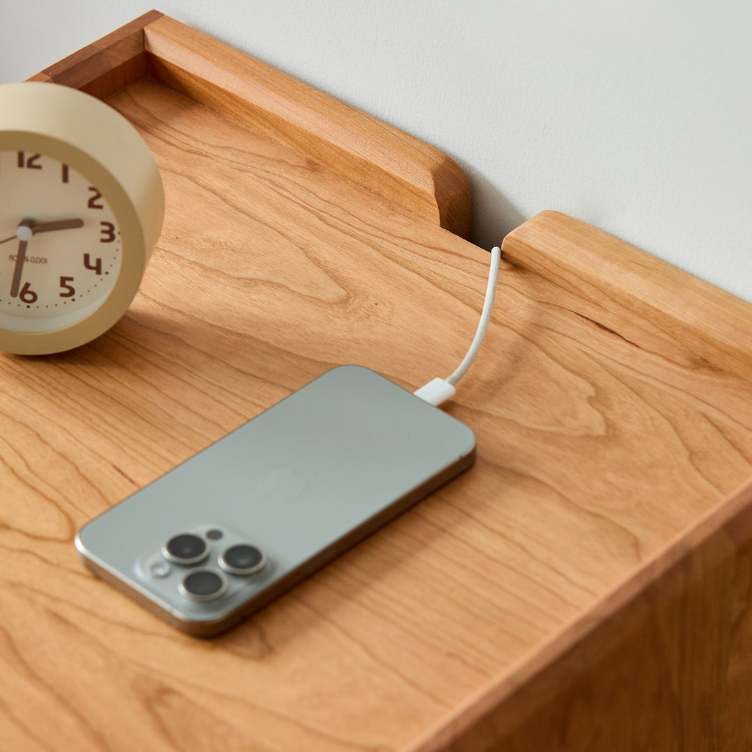Scandinavian cherry wood side table vista in close up details.