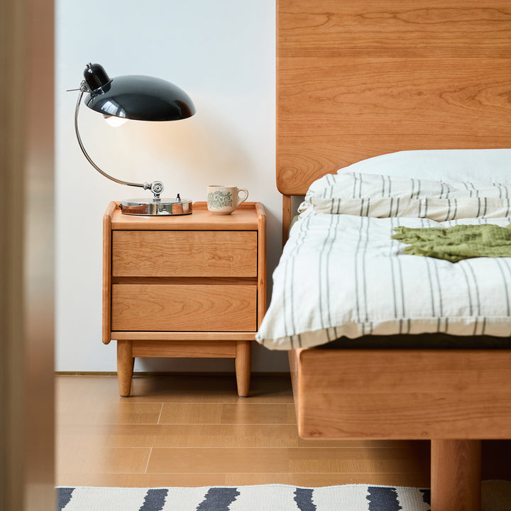 Scandinavian cherry wood side table vista in still life.