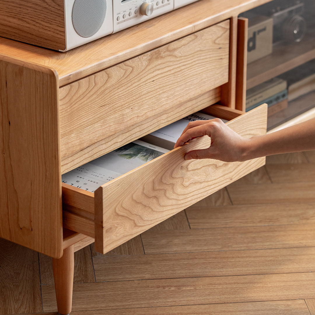 Scandinavian cherry wood tv console vista with context.