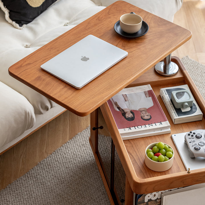 Scandinavian cherry wood wheeled trolley side table drift with context.