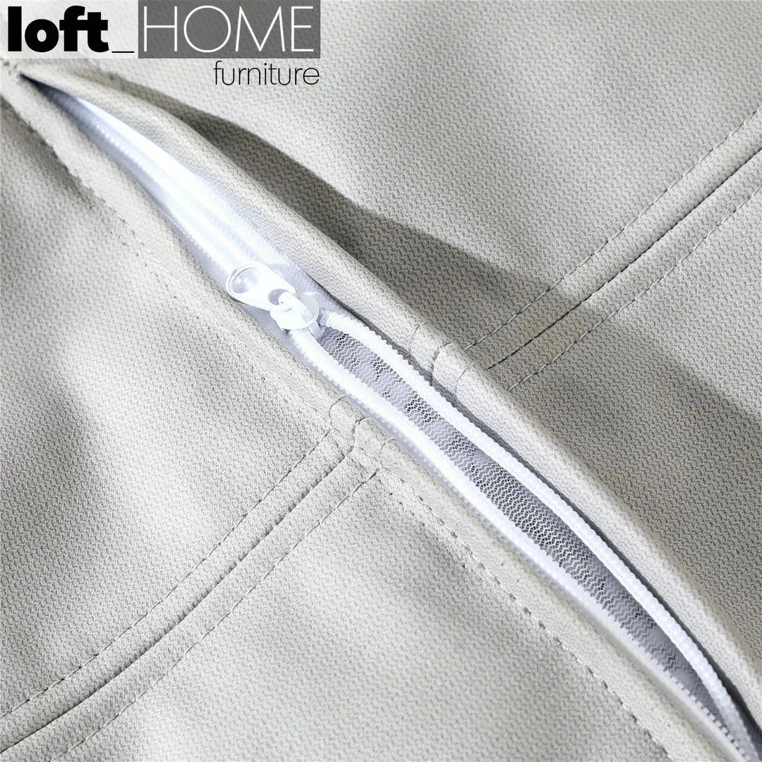 Modern fabric ottoman surya in real life style.