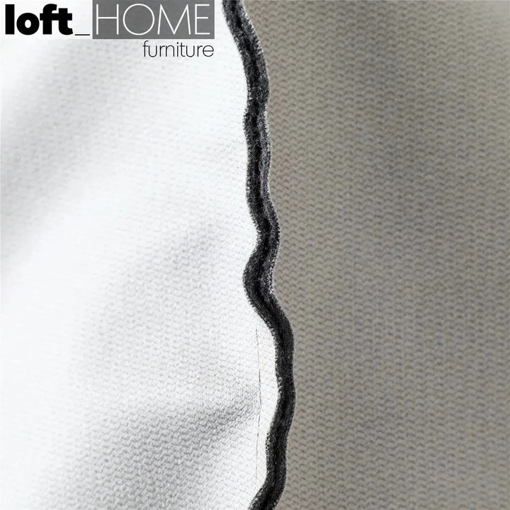 Modern fabric ottoman surya with context.