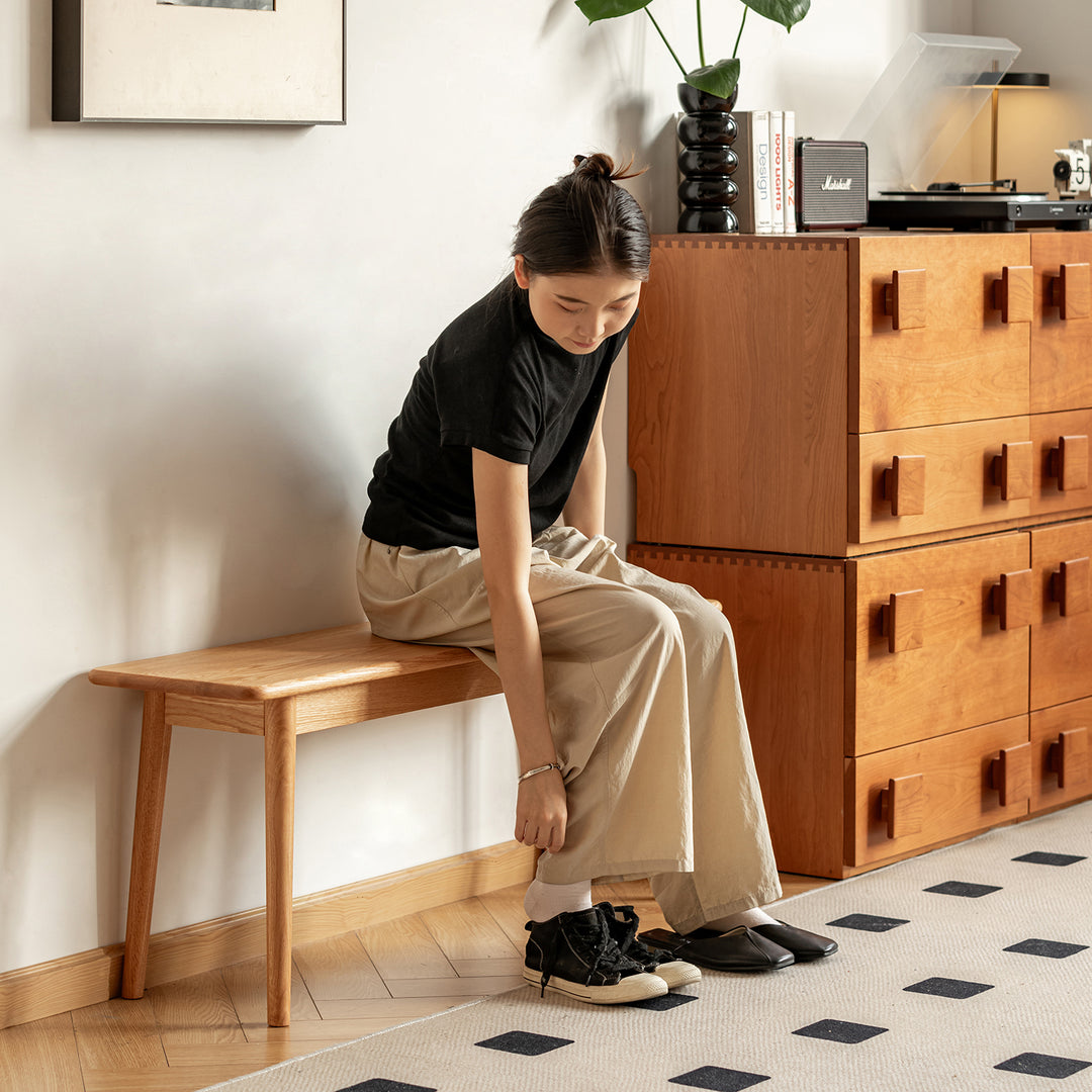 Scandinavian oak wood dining bench green in close up details.