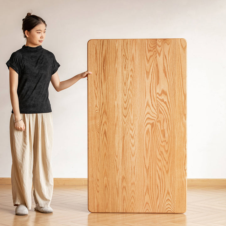 Scandinavian oak wood dining table green in close up details.