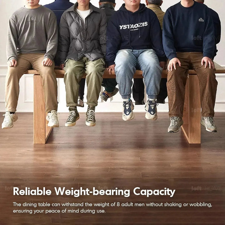 Scandinavian oak wood dining table kumo in close up details.